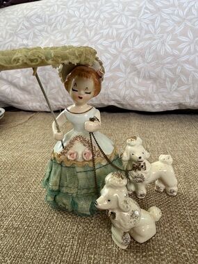 Vintage girl with poodles